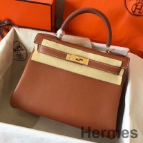 Geanta Hermes Kelly Retourne 28 lucrata manual din piele de vitel Swift auriu