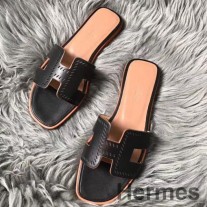 Sandalias perforadas Hermes Oran en cuero Swift negro