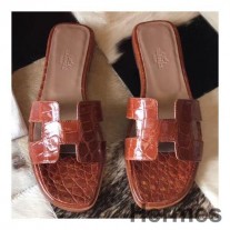 Hermes Oran-sandaler i oransje skinnende Niloticus-krokodille